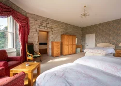 A view of the seating and dressers in the Bluebell bedroom.