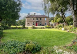 An outdoor view of Cholwell Hall and the garden