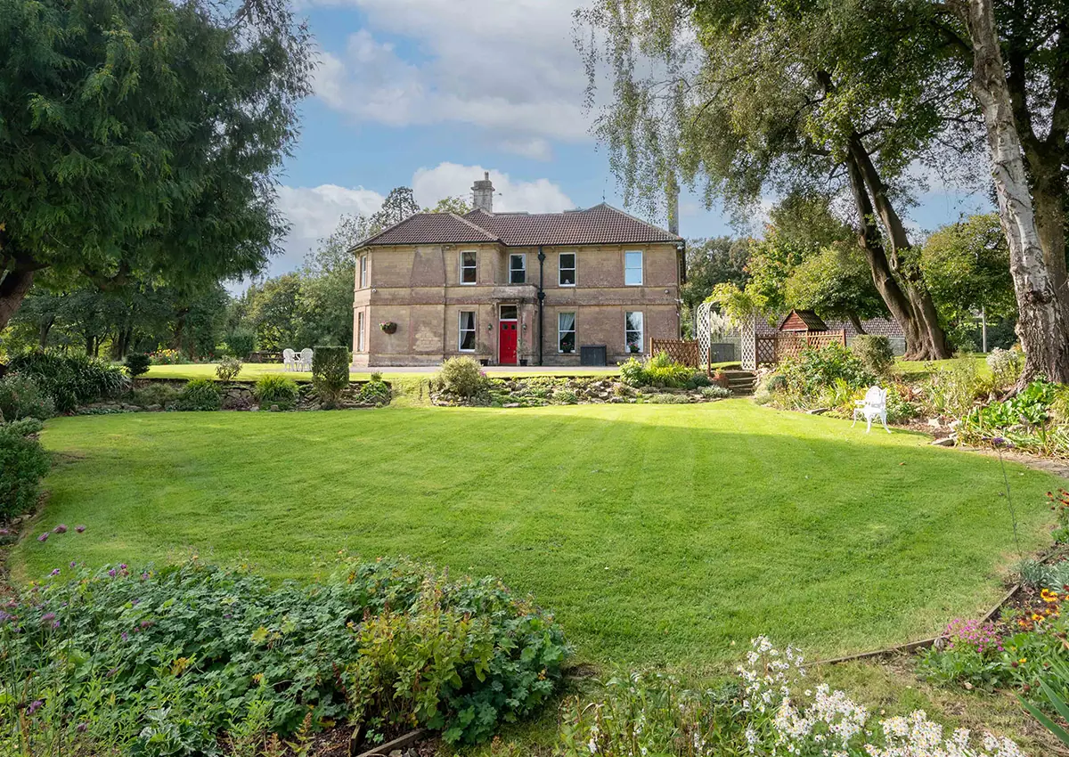 An outdoor view of Cholwell Hall and the garden