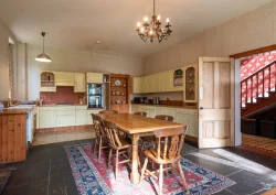 The Kitchen showing a wooden dining table