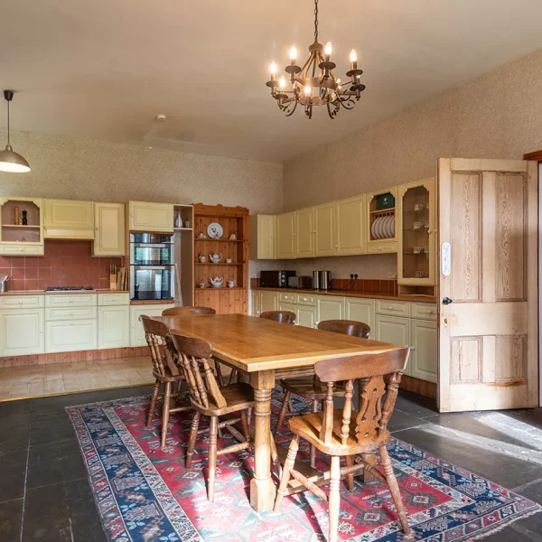 The Kitchen showing a wooden dining table