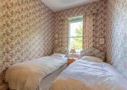 Two single beds in the Roses bedroom